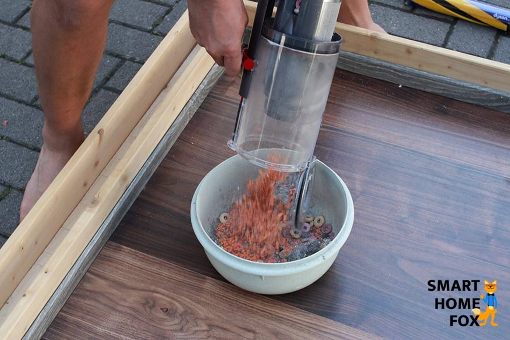 Emptying the dust bin.